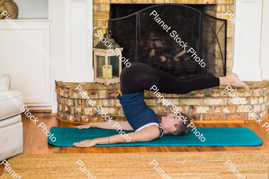 A young lady working out at home stock photo with image ID: 0029ed10-b582-477e-8e85-d12149bb06c7