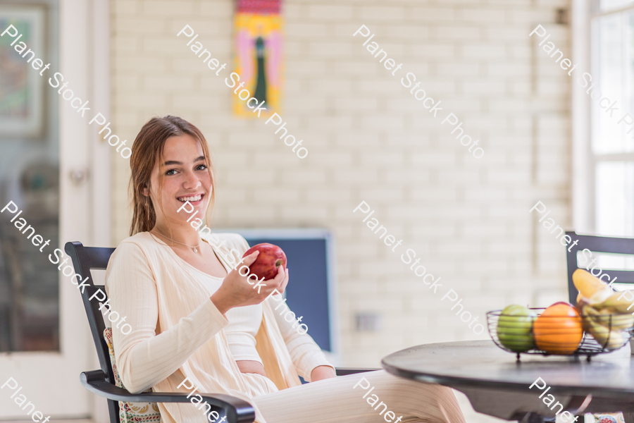 A young lady enjoying daylight at home stock photo with image ID: 01d5d06c-6885-4f14-96fd-78984da7b33b