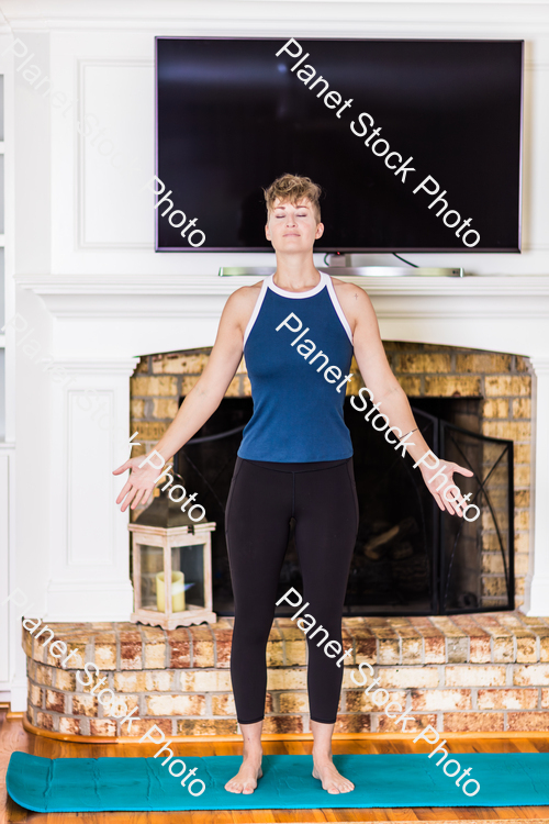 A young lady working out at home stock photo with image ID: 029f2a03-a528-4676-9037-9c14cae01b28