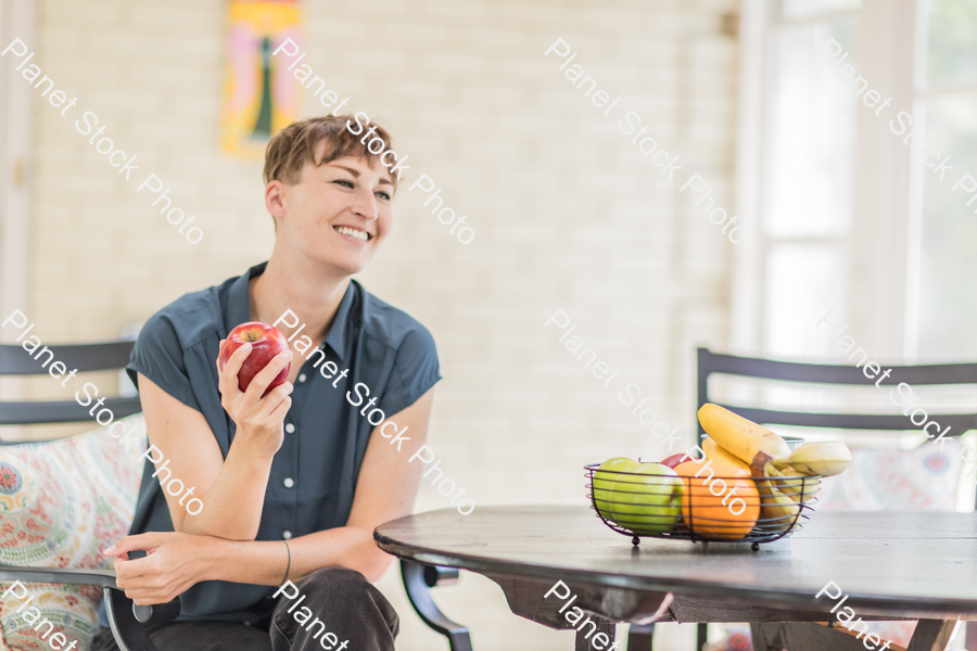 A young lady enjoying daylight at home stock photo with image ID: 02b5f804-460c-4b8a-a2b8-e20ae2666211