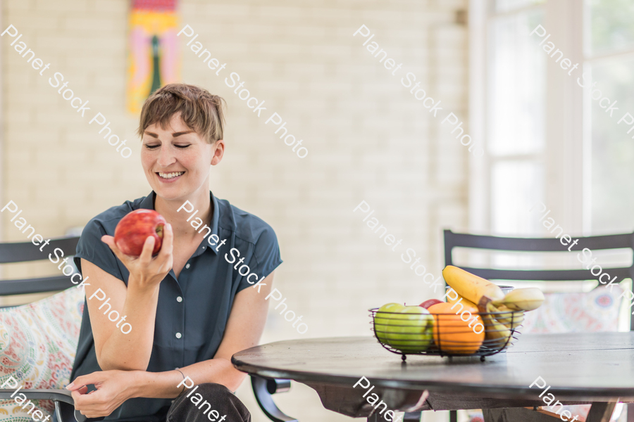 A young lady enjoying daylight at home stock photo with image ID: 02c3c5cc-47ca-477f-8e92-c1ac64de53b7