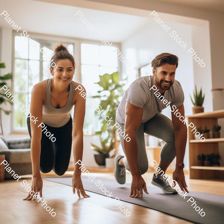 A Young Couple Working Out at Home stock photo with image ID: 03c5acf9-0055-4484-bb78-d6ecc0392fc8