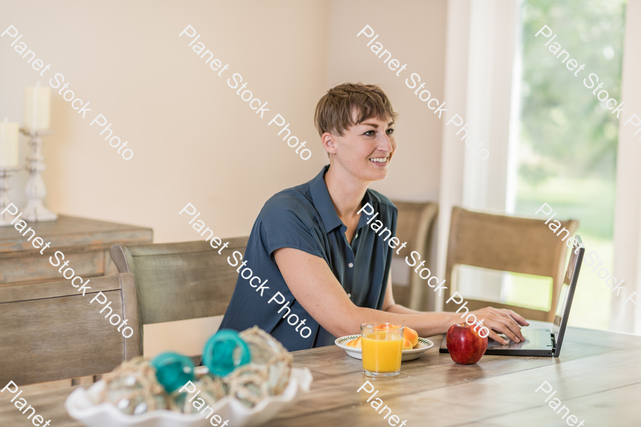A young lady having a healthy breakfast stock photo with image ID: 062caa42-8b0a-4c2b-8742-64c06378ed86