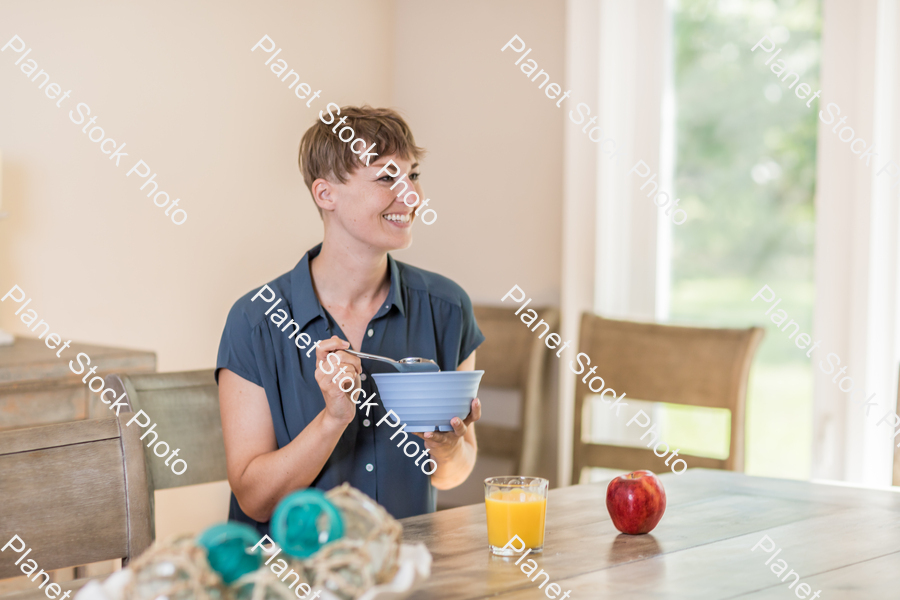 A young lady having a healthy breakfast stock photo with image ID: 07d4102a-edee-42f8-8a91-410ee741cf09