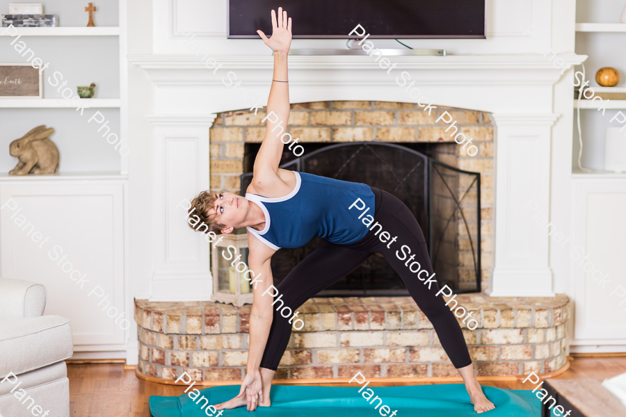 A young lady working out at home stock photo with image ID: 09851eb7-606f-41de-9bd1-ed39dbf77664