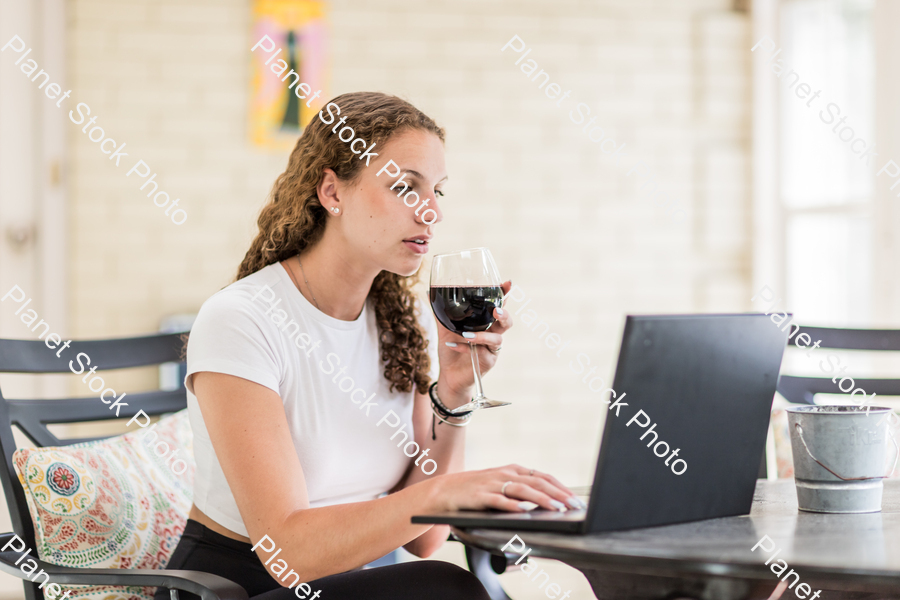 A young lady enjoying daylight at home stock photo with image ID: 0a7802b3-b885-4bdc-846c-43fb4fb12480