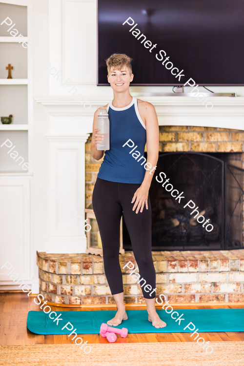 A young lady working out at home stock photo with image ID: 0b4861c3-7643-49f2-ad94-0393b7138a83