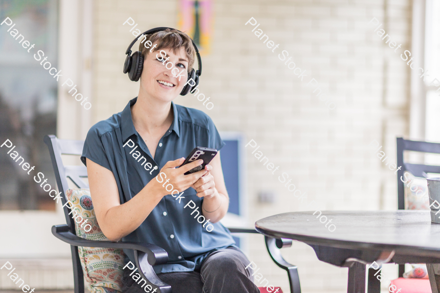 A young lady enjoying daylight at home stock photo with image ID: 0b91a550-9420-4995-9799-e3c09ab151fa