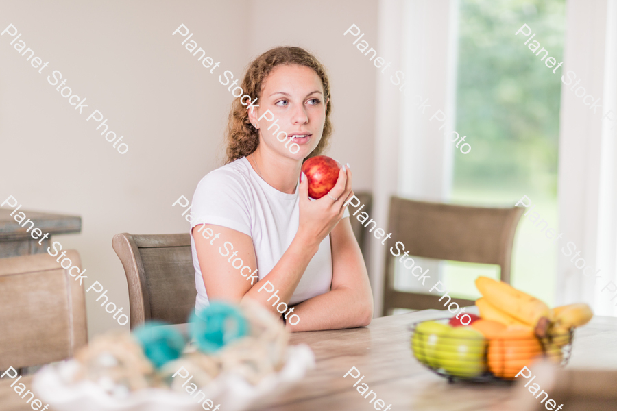 A young lady grabbing fruit stock photo with image ID: 0d2fb469-2c7a-4a2b-a6a1-b3179109c248
