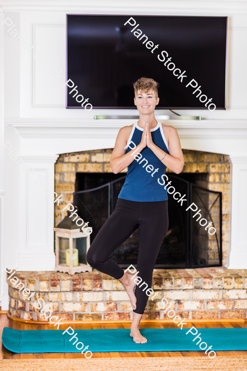 A young lady working out at home stock photo with image ID: 0e4fc3e0-6735-4898-b03e-dab19f756703