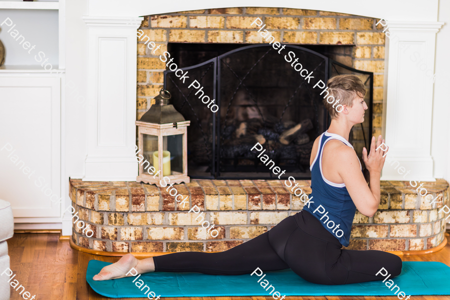 A young lady working out at home stock photo with image ID: 0ebf53e8-c2f4-4f4a-a962-5d0129248149