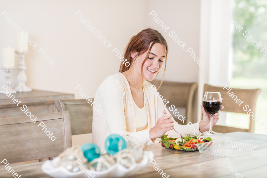 A young lady having a healthy meal stock photo with image ID: 0fa0d31c-ba74-44cc-876f-629820ba08f7