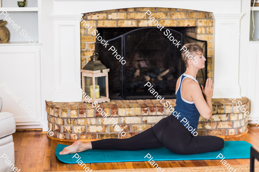 A young lady working out at home stock photo with image ID: 1221f453-fbaa-4d45-8a5b-731065781160