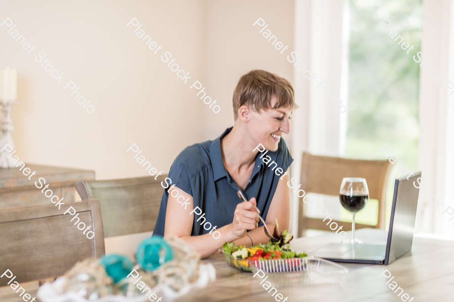 A young lady having a healthy meal stock photo with image ID: 12bb2abe-1a4a-4e49-894a-21556a8d978a