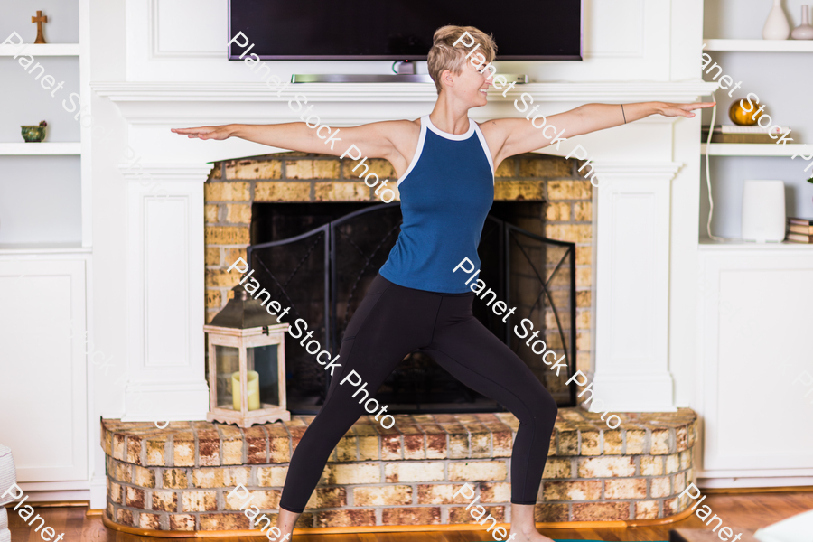 A young lady working out at home stock photo with image ID: 133f567a-8d7d-4ddf-b9af-33e3f880f822