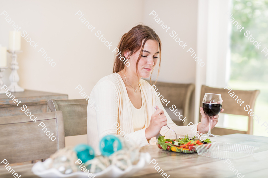 A young lady having a healthy meal stock photo with image ID: 1548c3f4-91cb-4894-b5bb-98ec7d2505ca