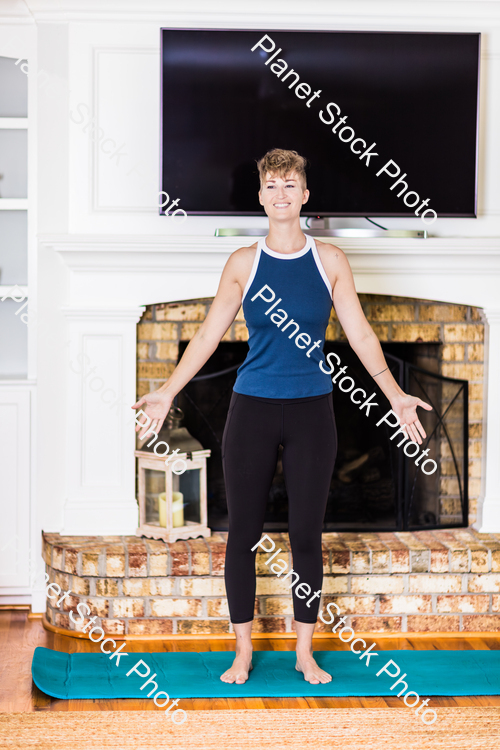 A young lady working out at home stock photo with image ID: 17702dee-6239-461a-879a-ac9ecf07ed73