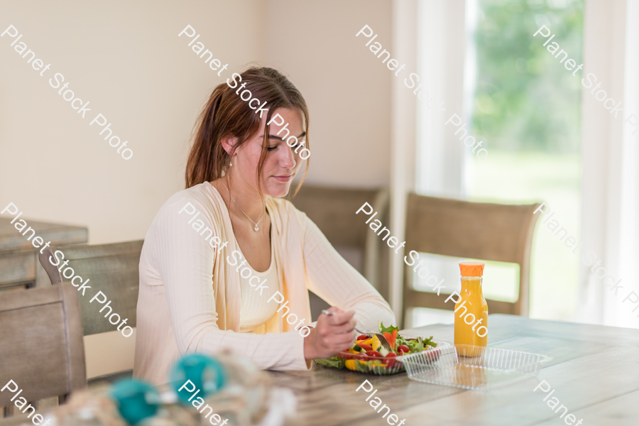 A young lady having a healthy meal stock photo with image ID: 18815bef-c0cc-41a6-958f-3a05b8130096