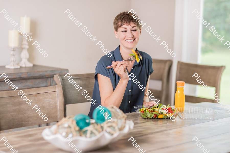 A young lady having a healthy meal stock photo with image ID: 192a1f6c-74fd-47fd-949e-0206425f7d78