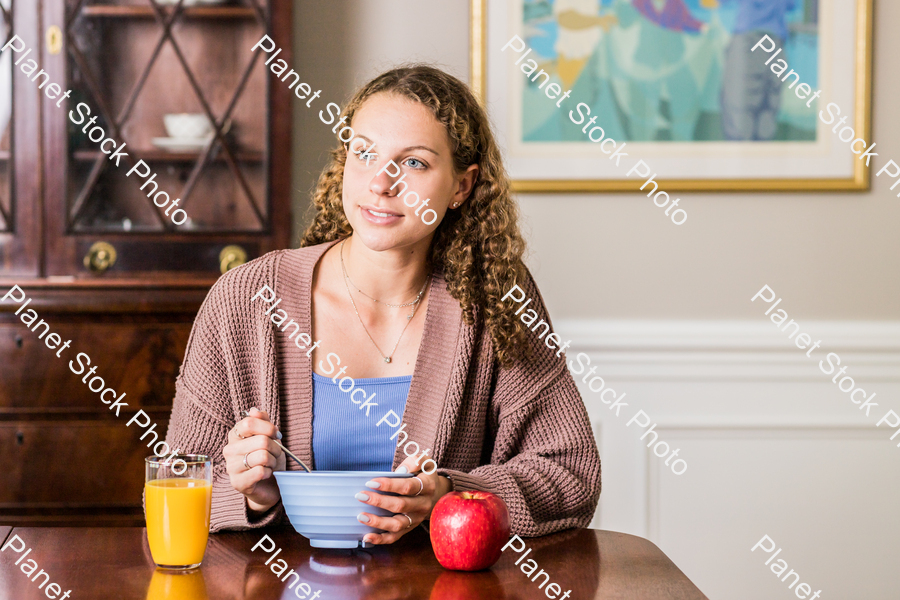 A young lady having a healthy breakfast stock photo with image ID: 192ac48b-8a68-42f4-a865-7655b8f170b6