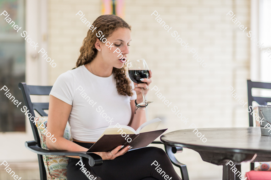 A young lady enjoying daylight at home stock photo with image ID: 19e167b8-8df6-4daf-951d-2f246b83e2d0