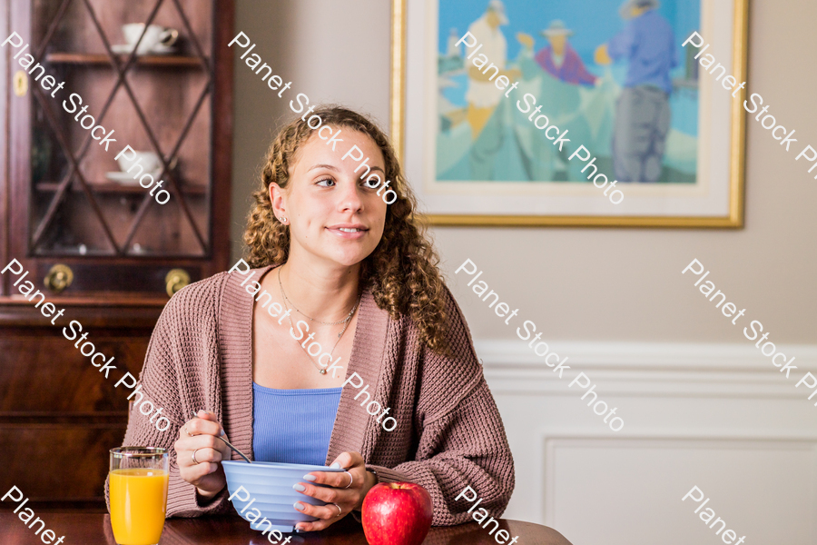 A young lady having a healthy breakfast stock photo with image ID: 1adbfd4d-92ee-4ec4-b5cf-09d510f7fb5d