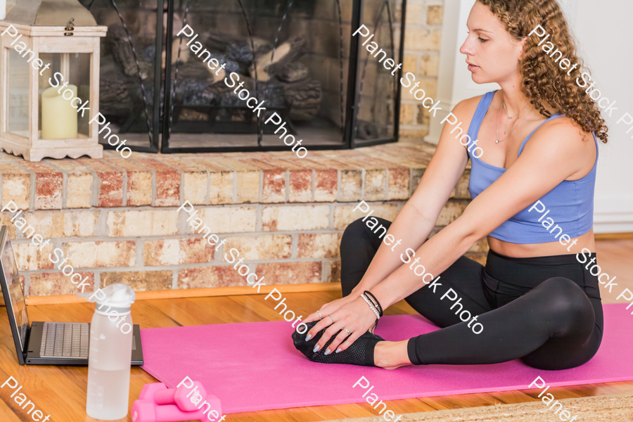 A young lady working out at home stock photo with image ID: 1b6491b4-d2b4-487b-a794-3a22536d3362