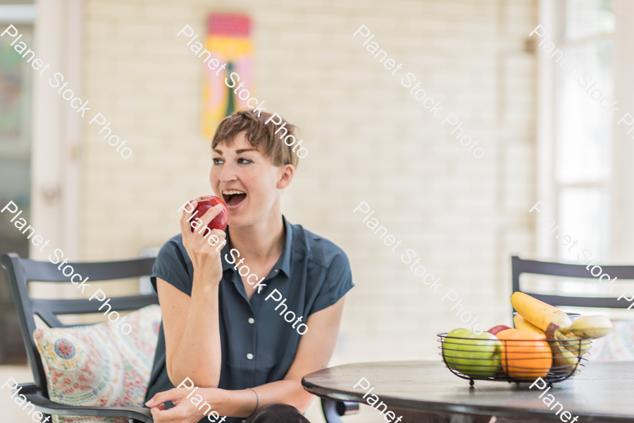 A young lady enjoying daylight at home stock photo with image ID: 1c17294d-63aa-4766-bc22-6c7c84c5891c