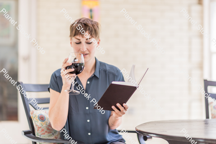 A young lady enjoying daylight at home stock photo with image ID: 1cc1cc30-62e5-49a3-b1f4-76239af5481e