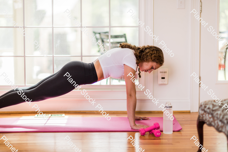 A young lady working out at home stock photo with image ID: 1d24f708-5ec8-45f6-a2bf-3a00301422ef