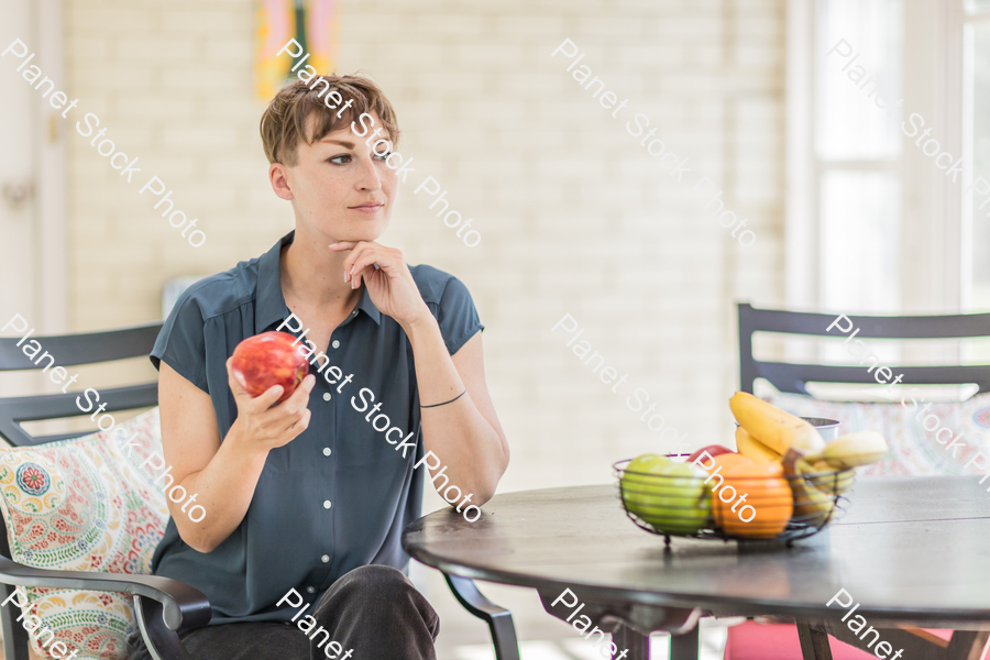 A young lady enjoying daylight at home stock photo with image ID: 1d70c5c7-1aab-4439-a3e9-0ec0fcb8247f