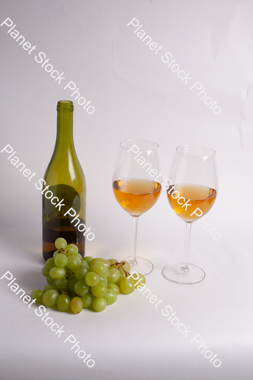 One bottle of white wine, with wine glasses, and grapes stock photo with image ID: 1de6baa8-a657-48ee-9766-cfd444c8b272