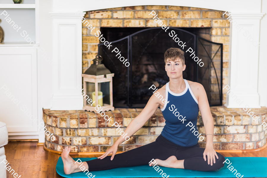 A young lady working out at home stock photo with image ID: 203891ea-8209-4b76-b9dc-8e8d529b37a1