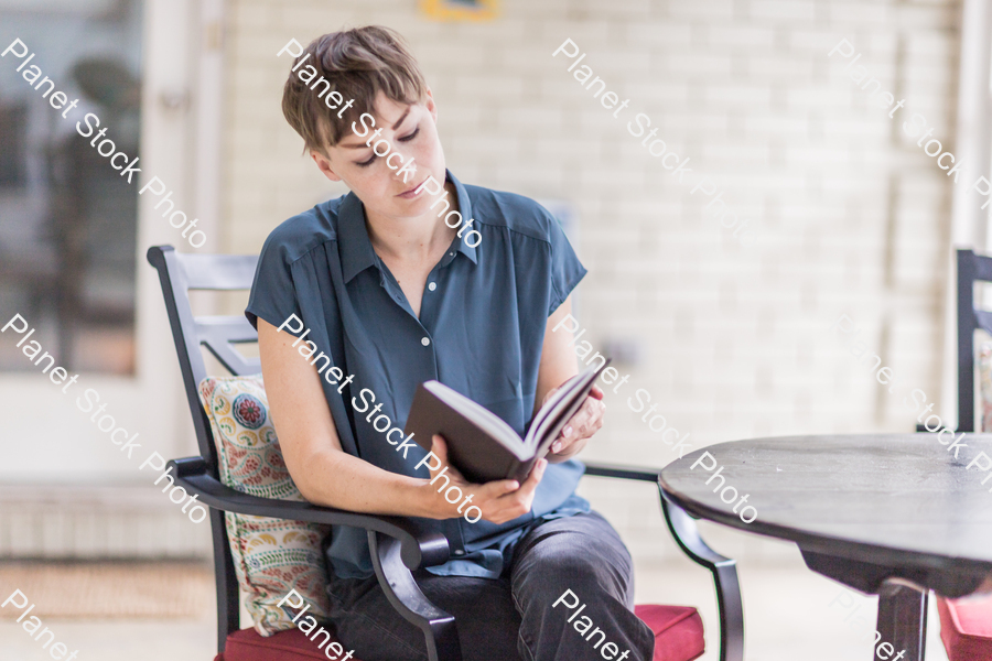 A young lady enjoying daylight at home stock photo with image ID: 203bc111-ba5f-4e45-8796-34a7c8819db1