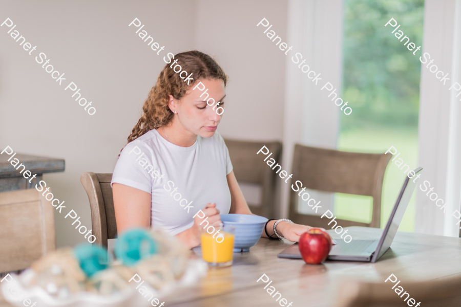 A young lady having a healthy breakfast stock photo with image ID: 21436973-a1d3-41d1-902f-326bc14f747d