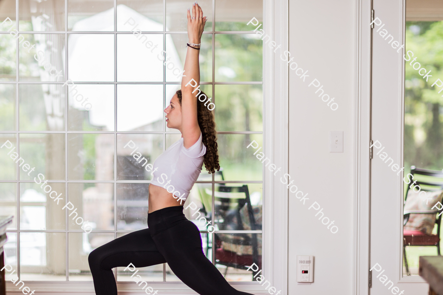 A young lady working out at home stock photo with image ID: 22b3ad65-6992-4dbc-a801-690b6f533cd8
