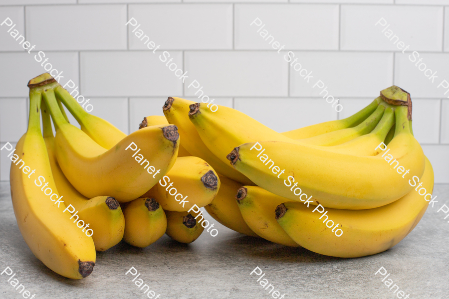 Two bunches of bananas stock photo with image ID: 24357c02-98ce-4649-a3a3-4f7fdfe20e36