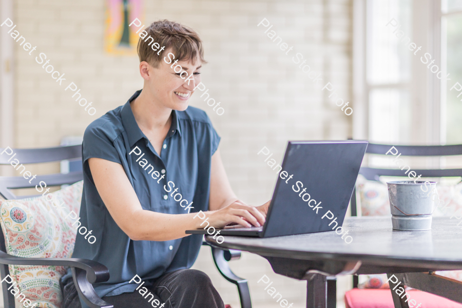 A young lady enjoying daylight at home stock photo with image ID: 2461891d-d070-48ff-aeed-beab27f8292b