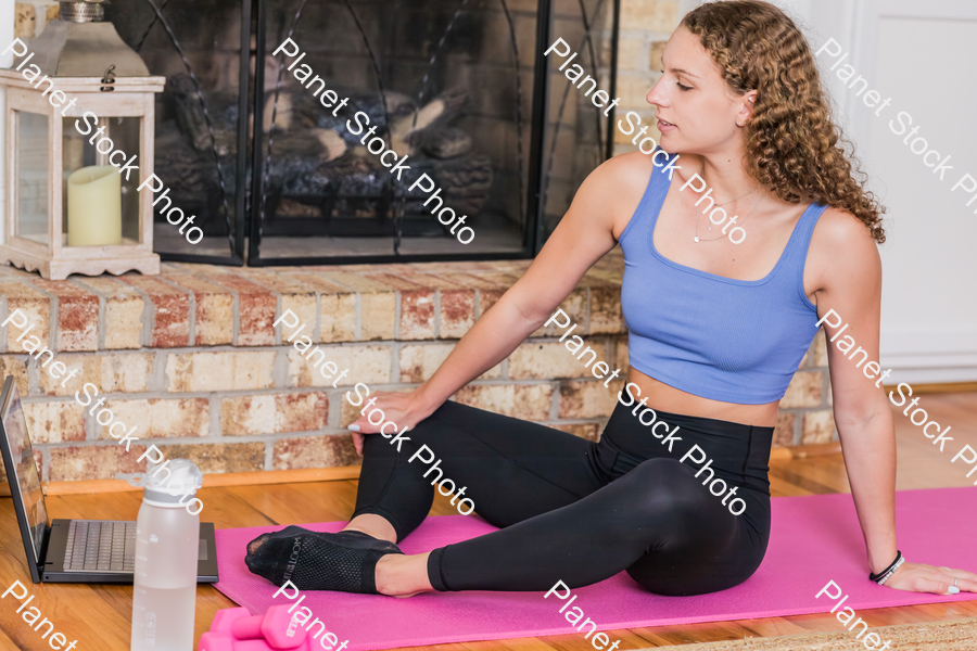 A young lady working out at home stock photo with image ID: 2588bd45-0a4b-44fd-9edb-7aca86fa075c