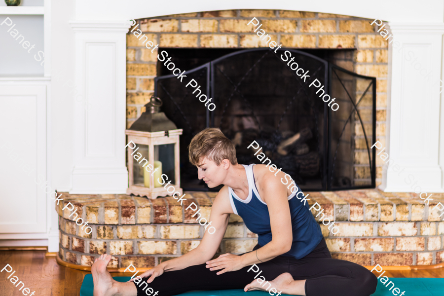 A young lady working out at home stock photo with image ID: 262d136a-e8c5-4c29-b39b-a42005e12391