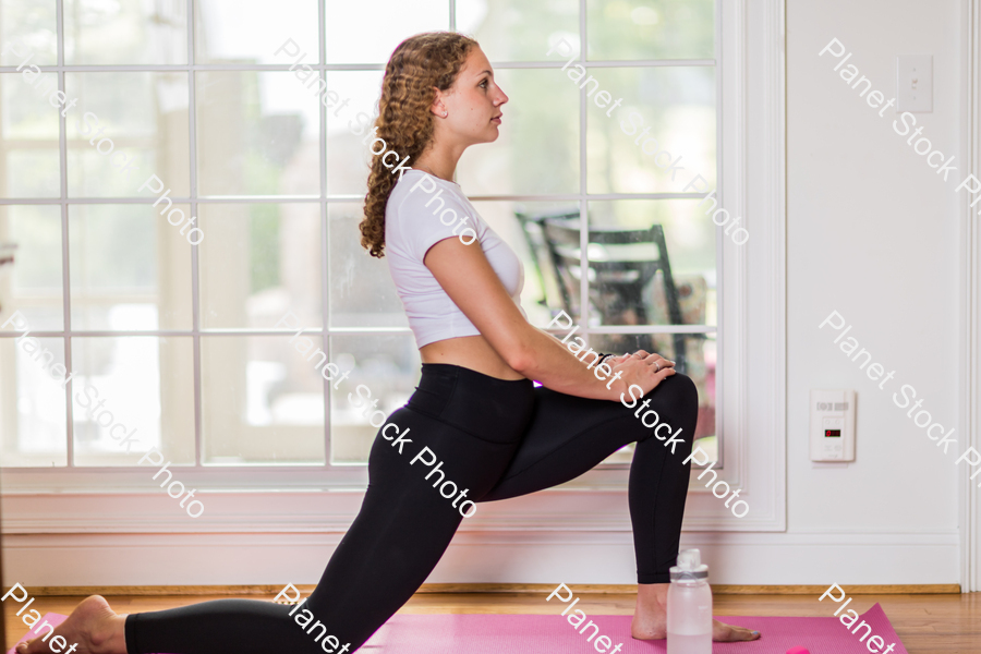 A young lady working out at home stock photo with image ID: 272d45a5-f99f-46a9-8161-b636bba46d43