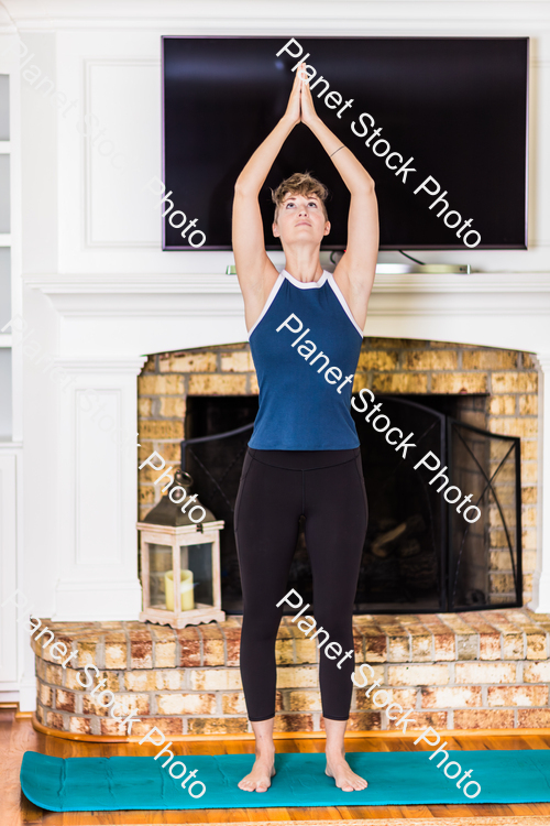 A young lady working out at home stock photo with image ID: 29515196-9b2e-41b5-bd76-feed2e23078a