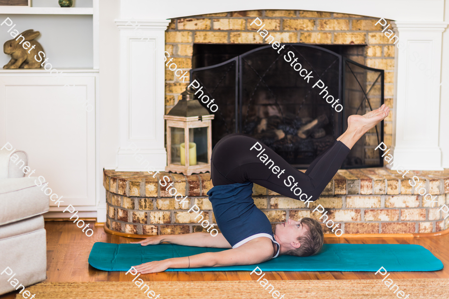 A young lady working out at home stock photo with image ID: 296b66bf-e72b-4d71-b011-3584d8f2d9a2