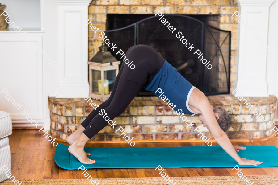 A young lady working out at home stock photo with image ID: 29cea4a7-e988-4ed2-a9bf-74d371861c0b