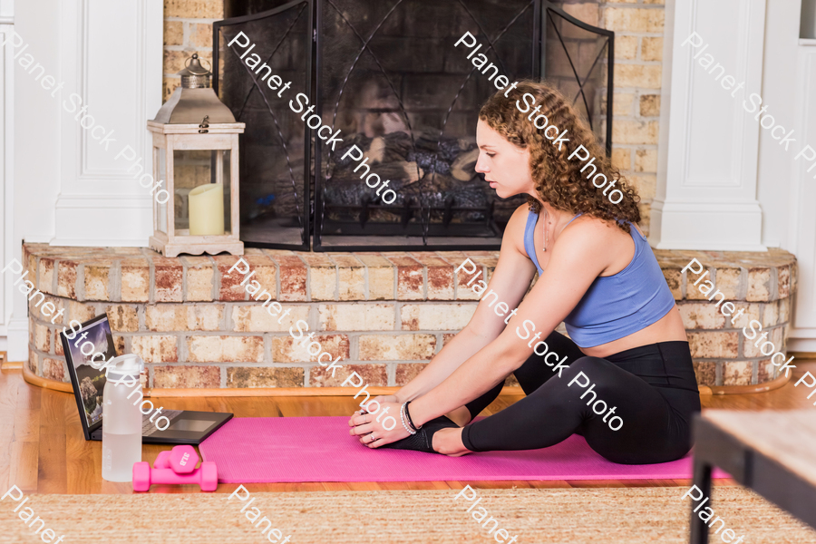 A young lady working out at home stock photo with image ID: 2a3953b4-9e76-4806-b5ca-1e217bfe8ae5