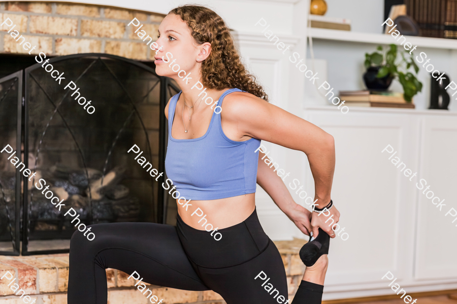 A young lady working out at home stock photo with image ID: 2c04f1ad-ba31-4cff-b56e-2aa0195bf1d0