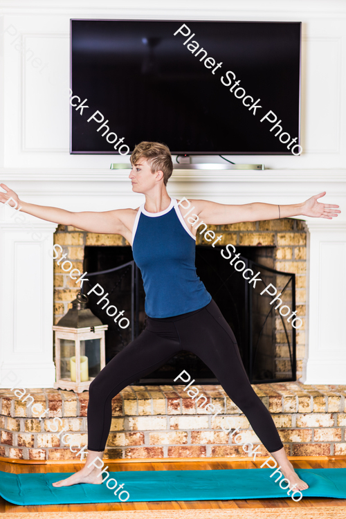 A young lady working out at home stock photo with image ID: 30802dc1-9690-46a8-b000-142db3866aa6