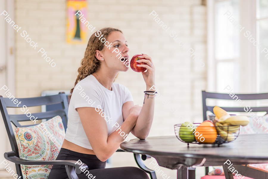 A young lady enjoying daylight at home stock photo with image ID: 3166f200-427c-4241-b787-5c429546d15f