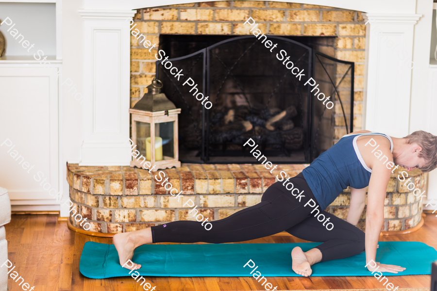 A young lady working out at home stock photo with image ID: 31716e0a-7c12-403c-877a-c4ce16009cf2