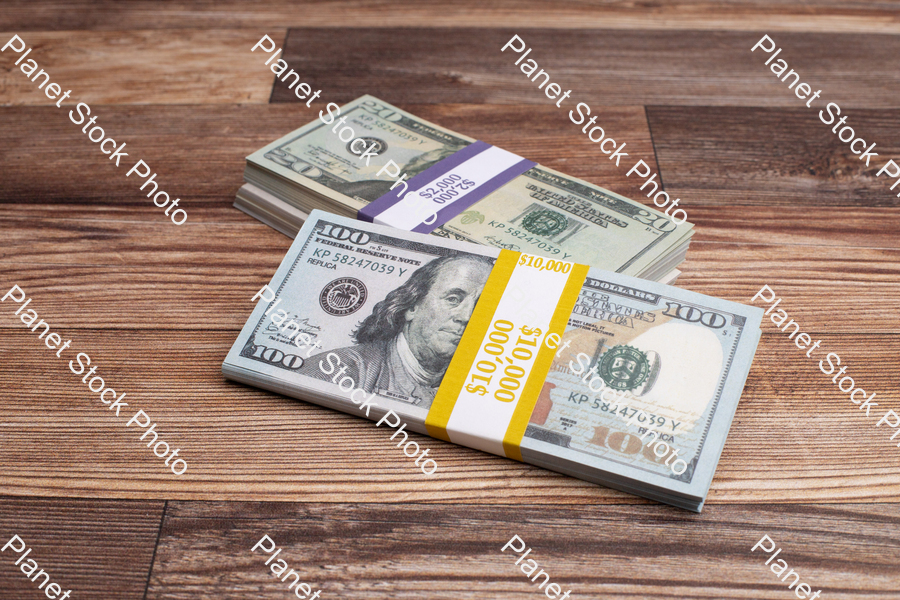 Three stacks of dollar bills stock photo with image ID: 32317607-f6be-4977-a68b-6ad93e06309f